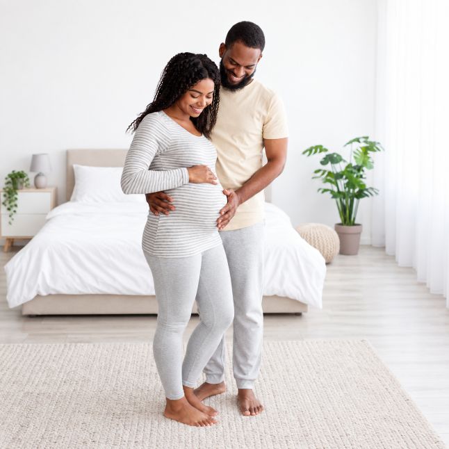 mother and father having a bonding moment with their unborn child